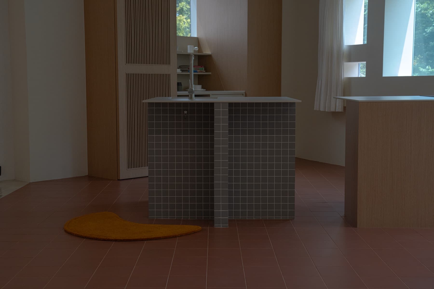 Ochre rug on a tiled floor beside a kitchen island